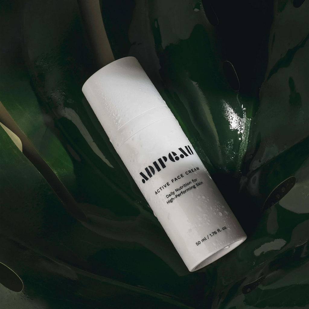 adipeau active face cream on a leaf