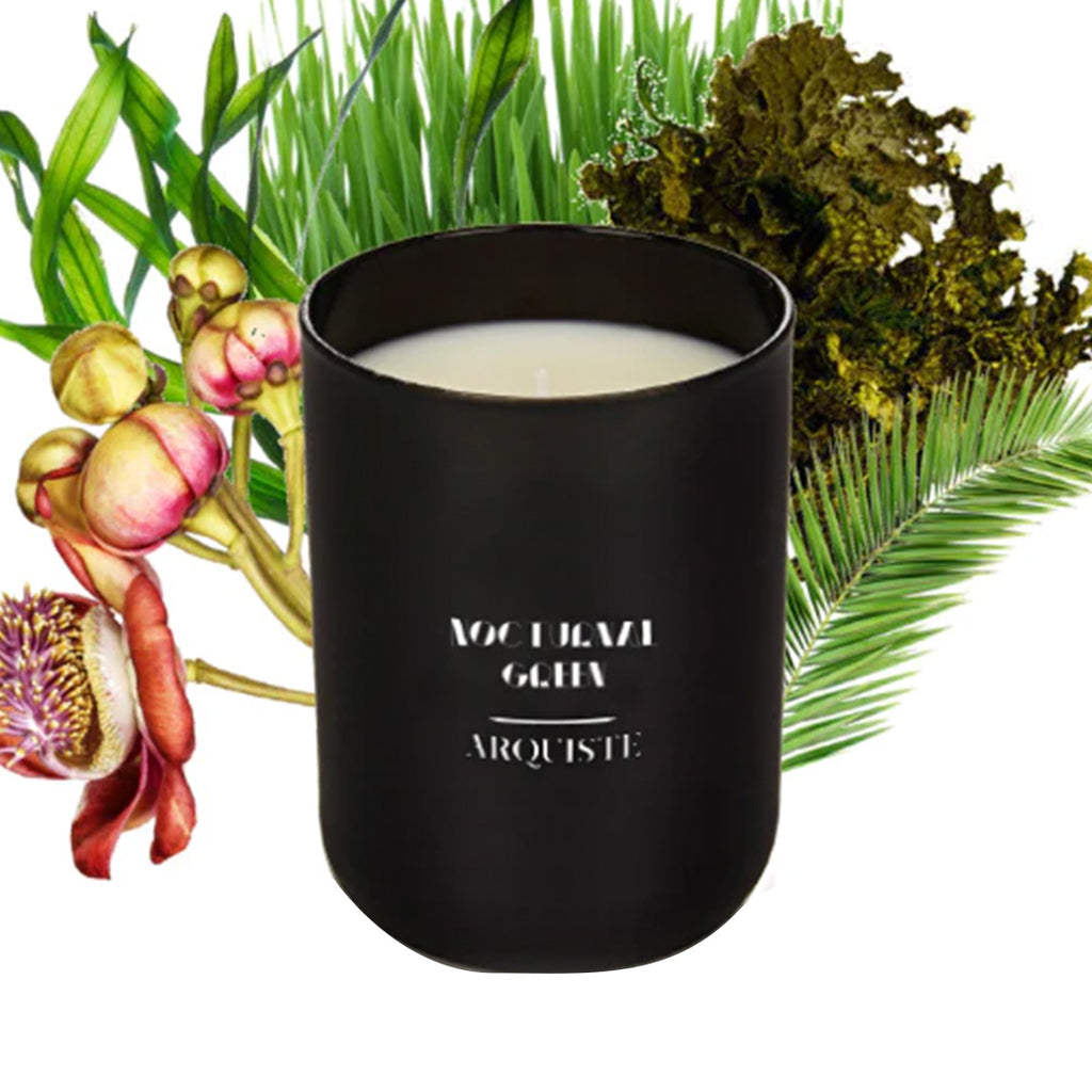 arquiste noctural green candle with flowers in the back