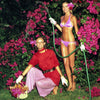 two women in a flower garden