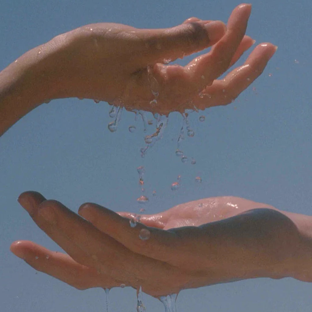 hands holding water