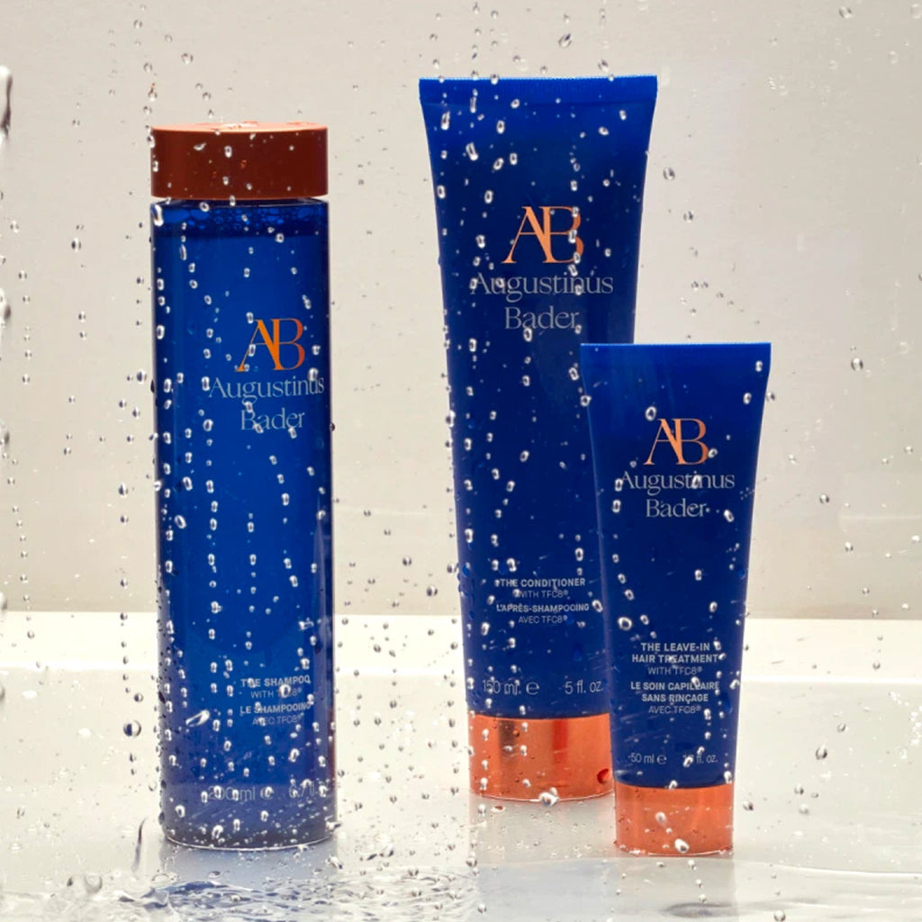 augustinus bader hair care collection in the shower