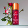 Augustinus Bader The Geranium Rose Body Oil with rose background