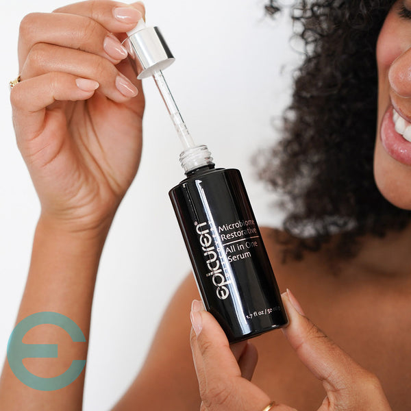 woman holding Epicuren Microbiome Restorative All In One Serum