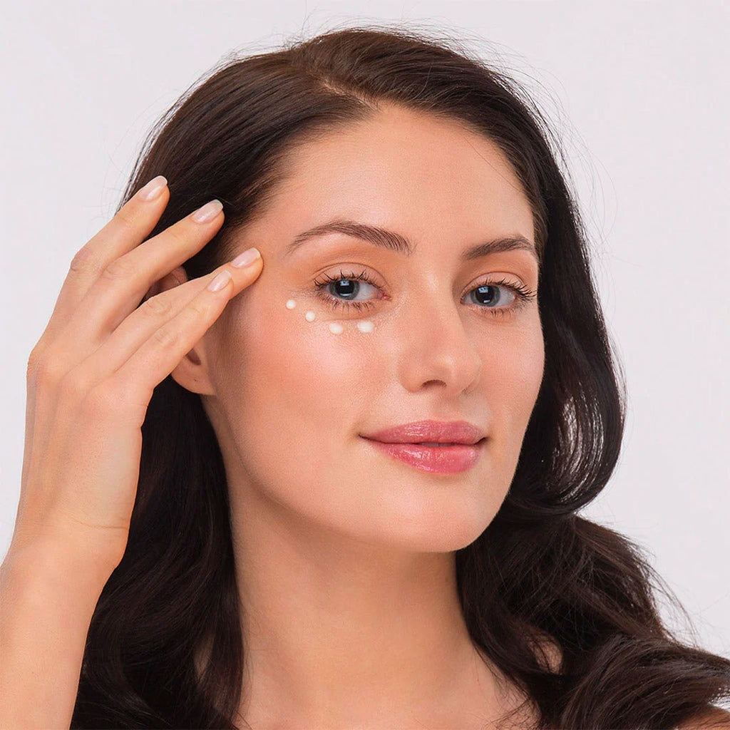 woman dabbing Meder Blepharo-Rich Eye Cream under eyes