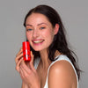 woman holding Meder Red-Apax Concentrate