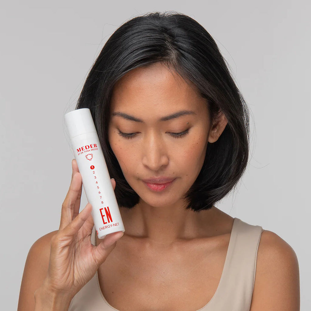 woman holding Meder Nrj-Net Revitalising Cleansing Mask