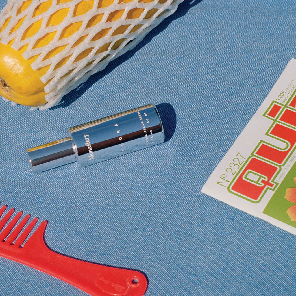 flat lay of Monastery Flora with comb and canteloupe